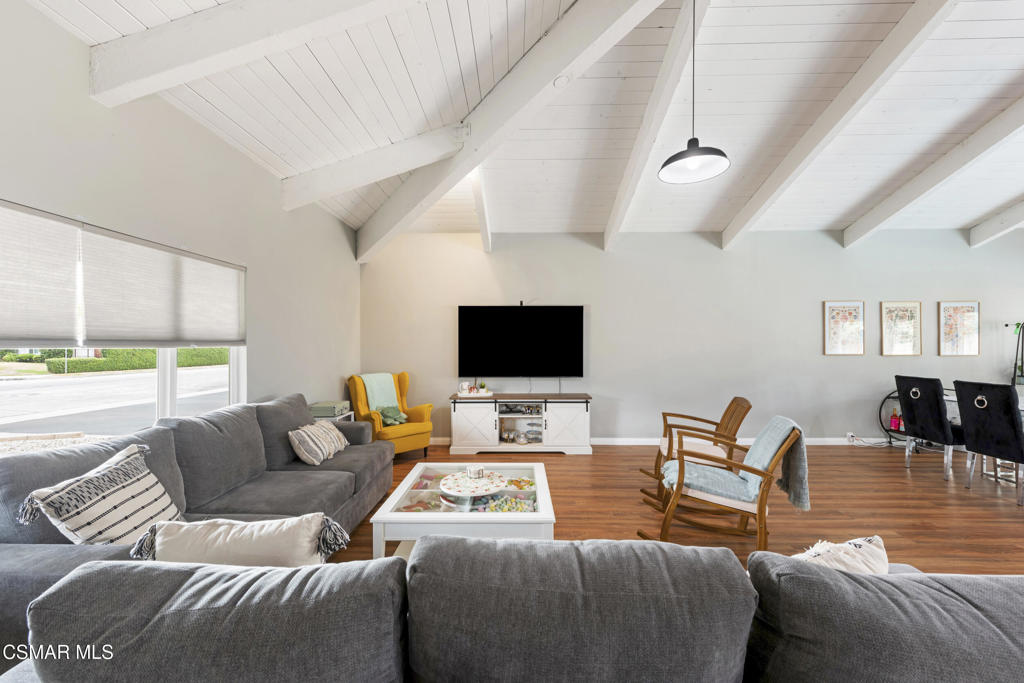 2125 Yosemite Avenue Simi Valley, CA 93063 - Photo 4 of 31 a living room with furniture wooden floor and a flat screen tv