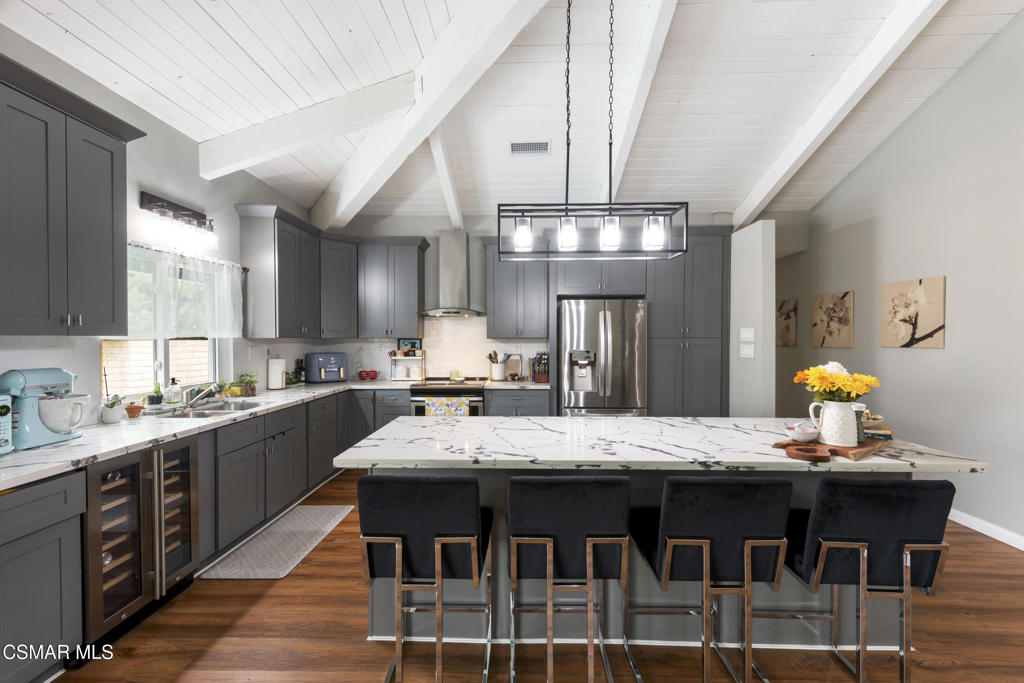 2125 Yosemite Avenue Simi Valley, CA 93063 - Photo 6 of 31 a kitchen with a dining table and chairs