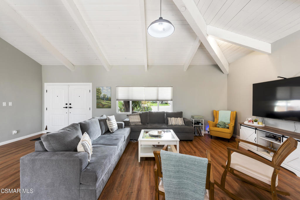2125 Yosemite Avenue Simi Valley, CA 93063 - Photo 9 of 31 a living room with furniture and a flat screen tv