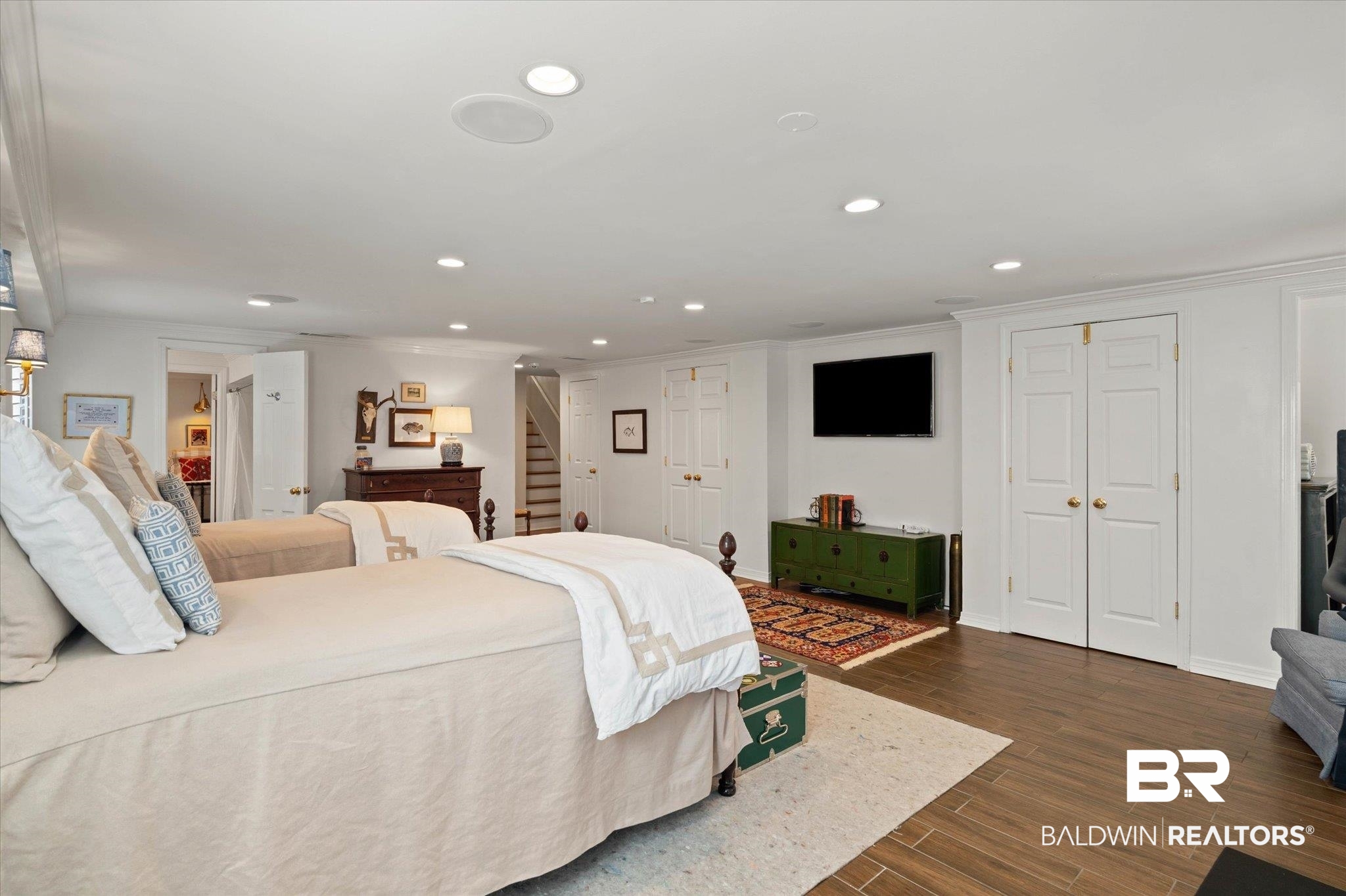 3612 Linden Lane Mobile, AL 36608 - Photo 35 of 42 Bedroom featuring recessed lighting, ornamental molding, dark wood-style flooring, and two closets