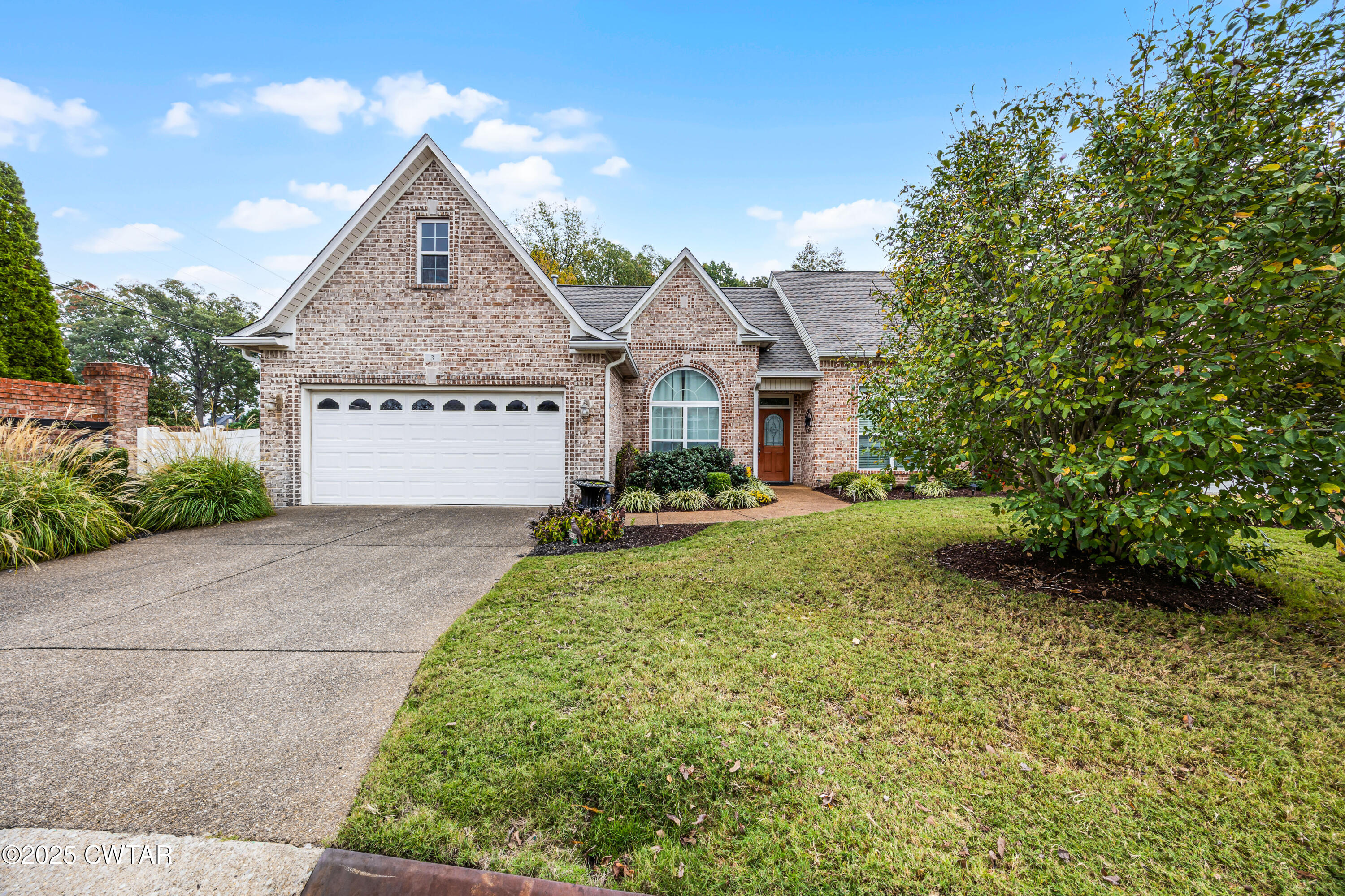 3 Emerald Ridge Cove Jackson, TN 38305 - Photo 1 of 26 a front view of a house with a yard