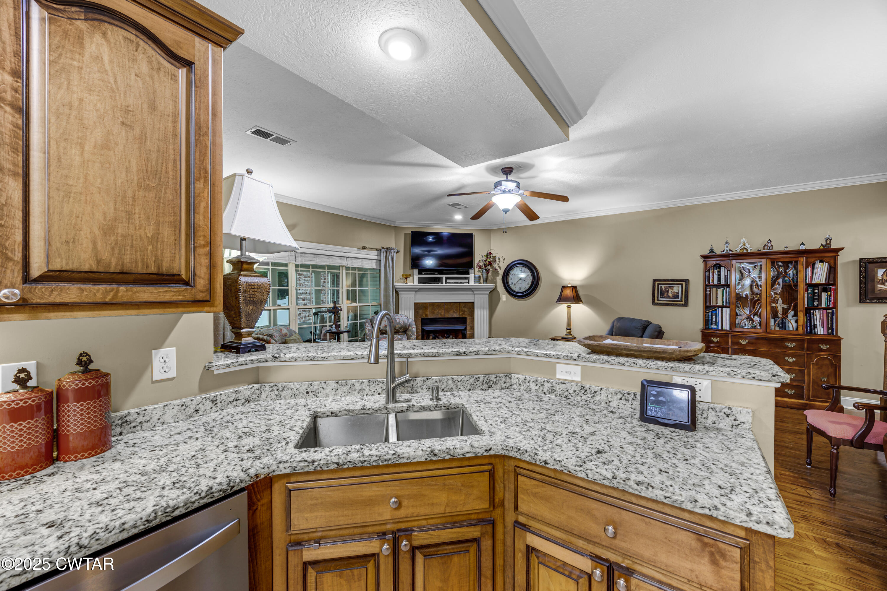 3 Emerald Ridge Cove Jackson, TN 38305 - Photo 15 of 26 a kitchen with kitchen island granite countertop a sink appliances and cabinets