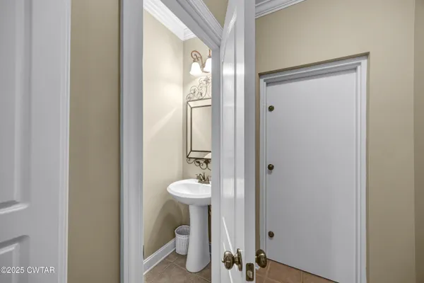 a bedroom that has a bed and a dresser in it