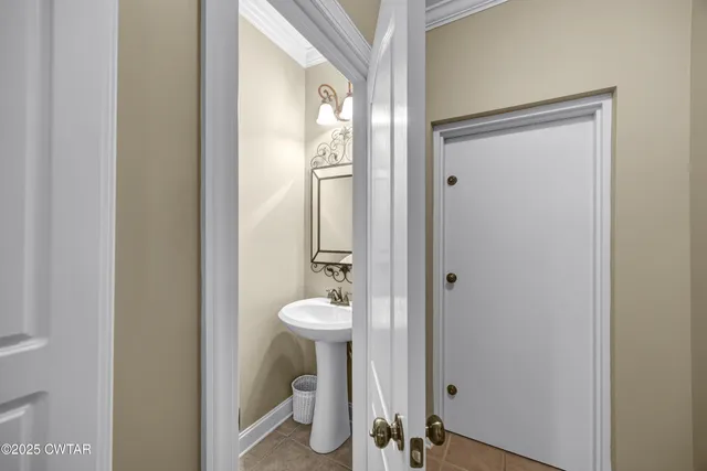 a bedroom that has a bed and a dresser in it