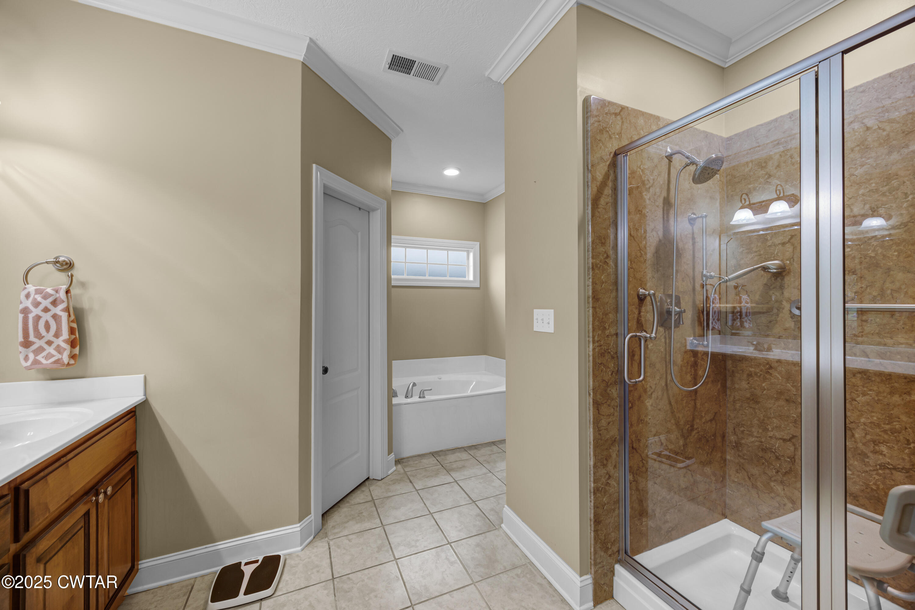 3 Emerald Ridge Cove Jackson, TN 38305 - Photo 21 of 26 a bathroom with a shower and a sink