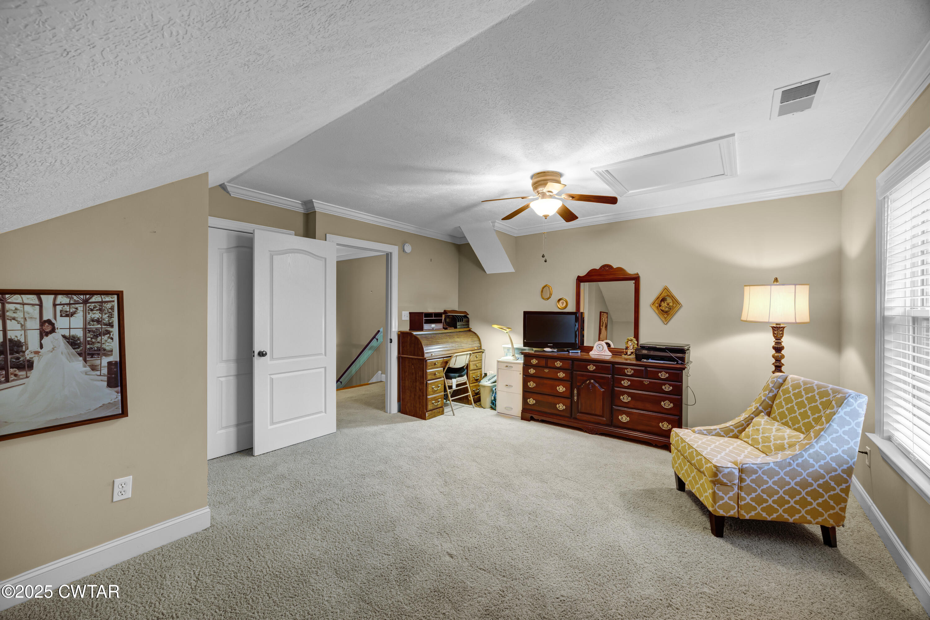 3 Emerald Ridge Cove Jackson, TN 38305 - Photo 24 of 26 a living room with furniture and a chandelier