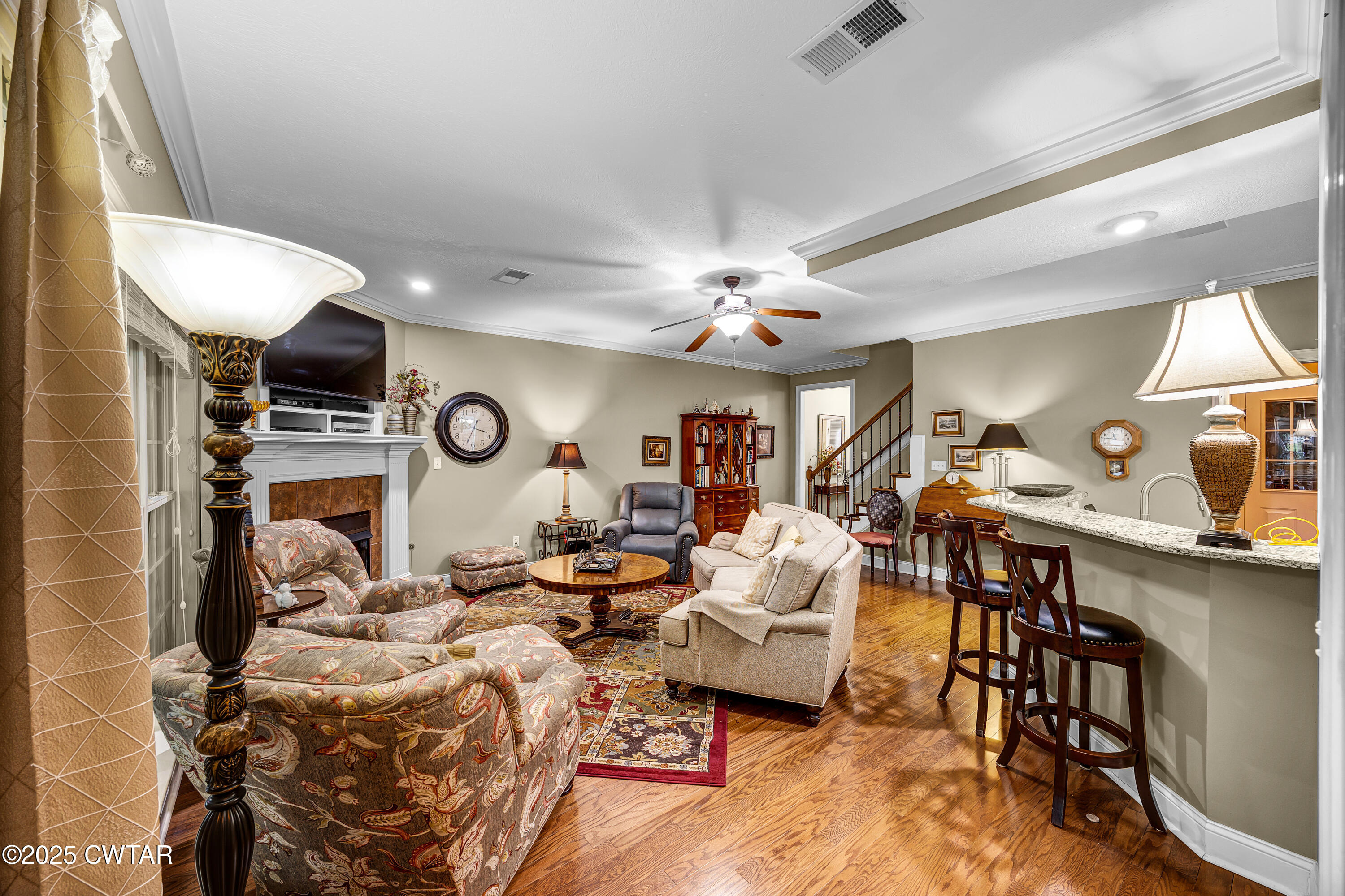 3 Emerald Ridge Cove Jackson, TN 38305 - Photo 8 of 26 a living room with furniture a clock and a window