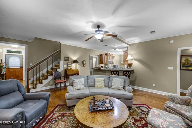 a kitchen with stainless steel appliances granite countertop a sink a stove and a refrigerator