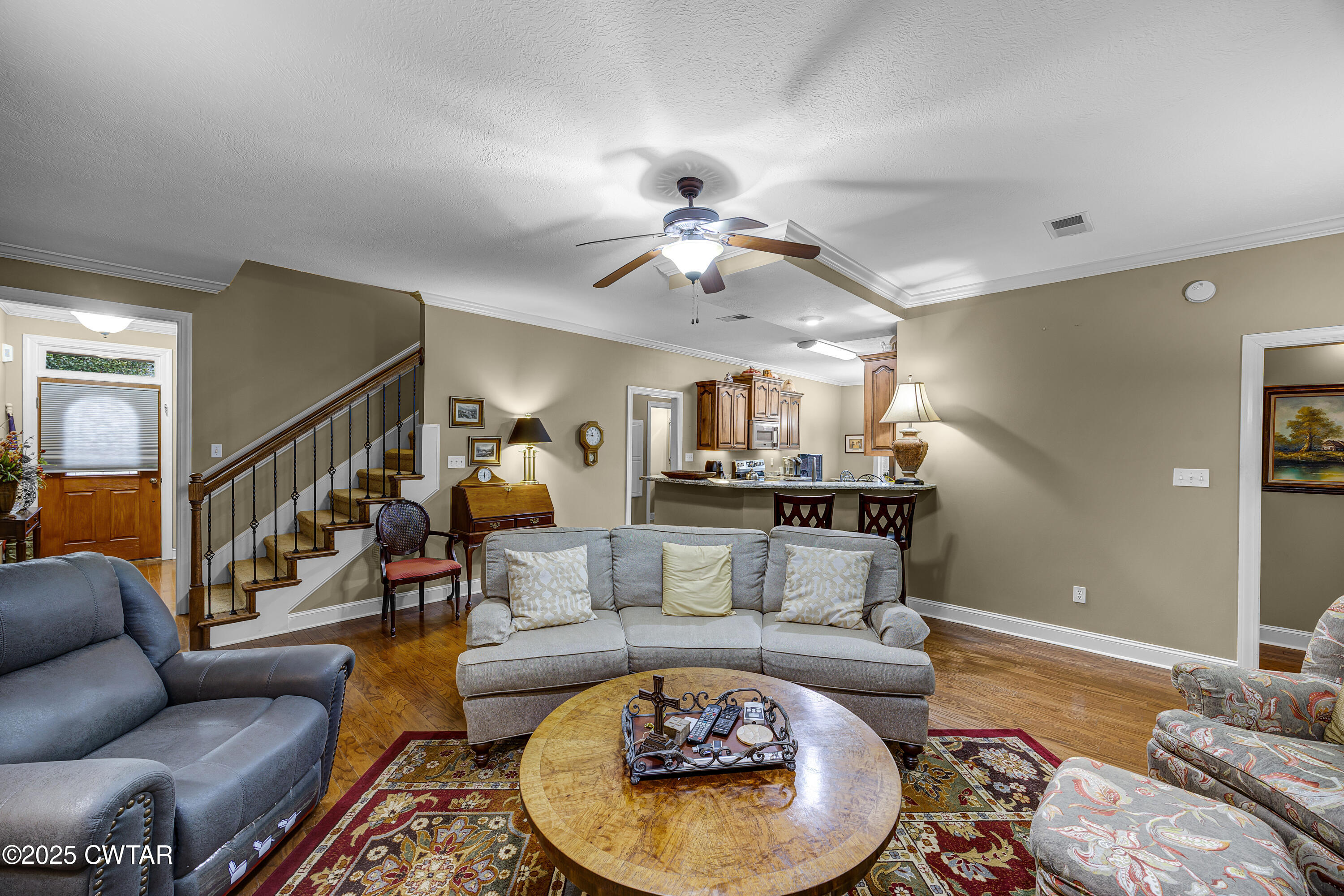 3 Emerald Ridge Cove Jackson, TN 38305 - Photo 10 of 26 a living room with furniture and a chandelier