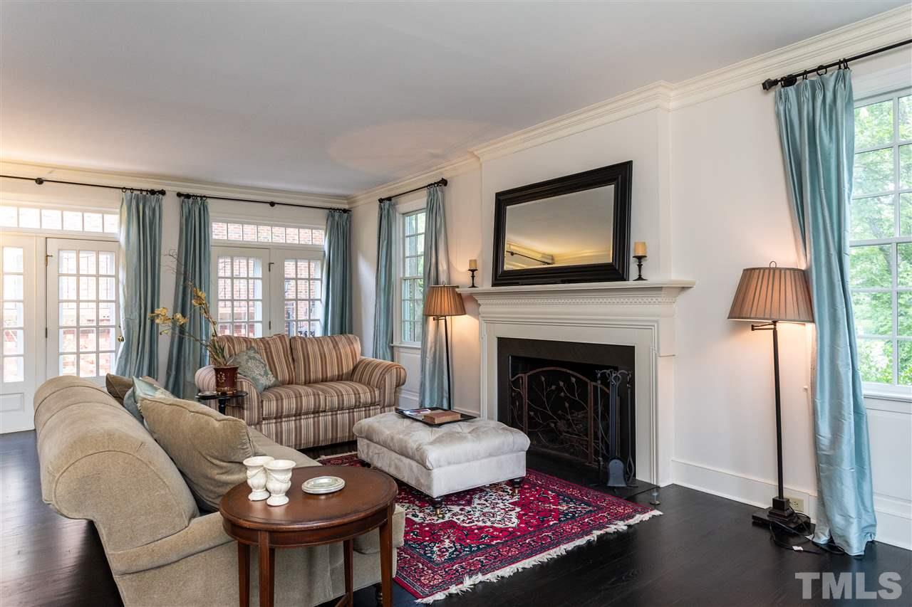 1109 Cowper Drive Raleigh, NC 27608 - Photo 3 of 25 a living room with furniture fireplace and window