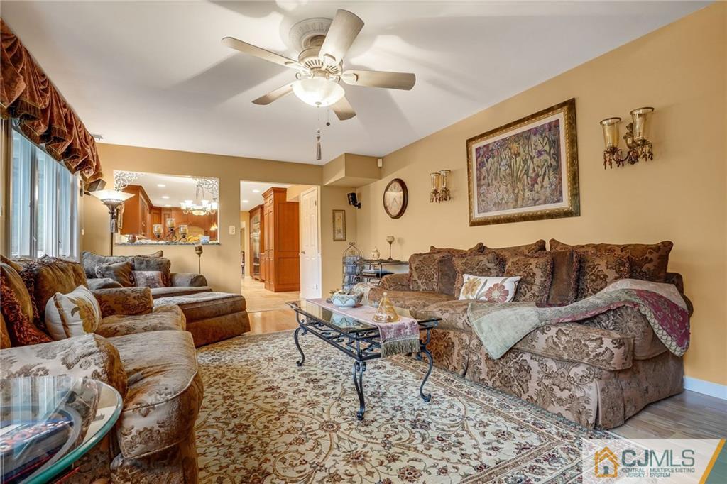 60 Higgins Road Old Bridge, NJ 08857 - Photo 12 of 25 a living room with furniture and a large window