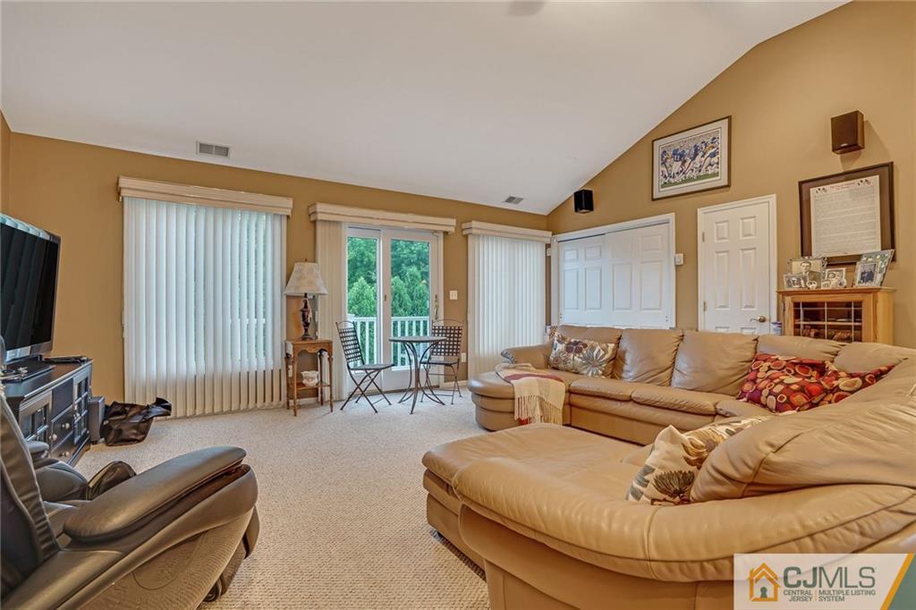 60 Higgins Road Old Bridge, NJ 08857 - Photo 15 of 25 a living room with furniture and a flat screen tv