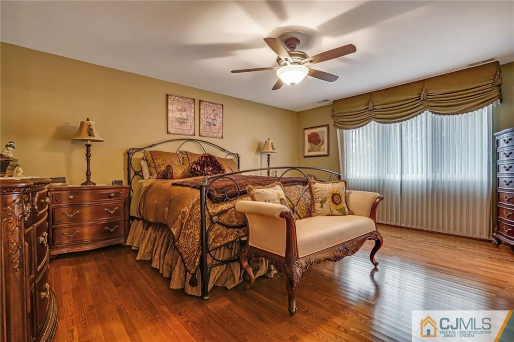 60 Higgins Road Old Bridge, NJ 08857 - Photo 19 of 25 a bedroom with furniture and wooden floor