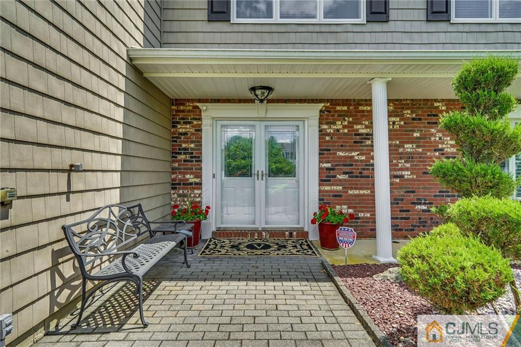 60 Higgins Road Old Bridge, NJ 08857 - Photo 3 of 25 a front view of a house with a garden