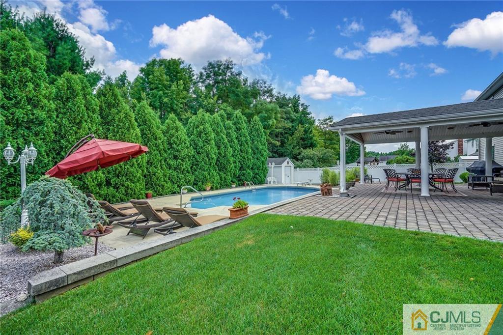 60 Higgins Road Old Bridge, NJ 08857 - Photo 23 of 25 a view of a backyard with sitting area