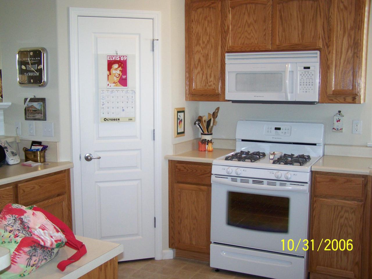 2354 Suzette Avenue Redding, CA 96002 - Photo 4 of 14 a kitchen with a stove and cabinets
