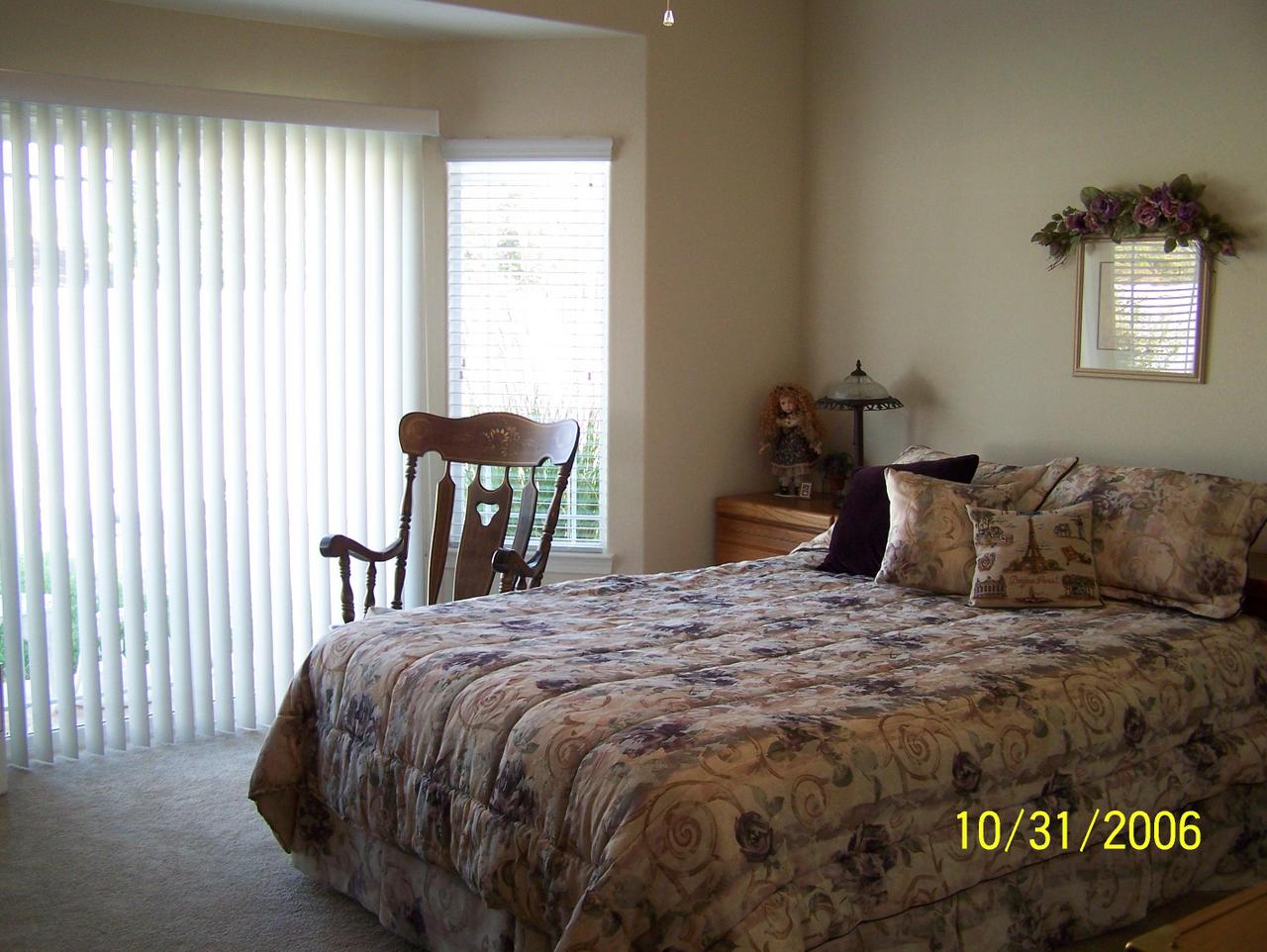 2354 Suzette Avenue Redding, CA 96002 - Photo 7 of 14 a bedroom with a bed and window