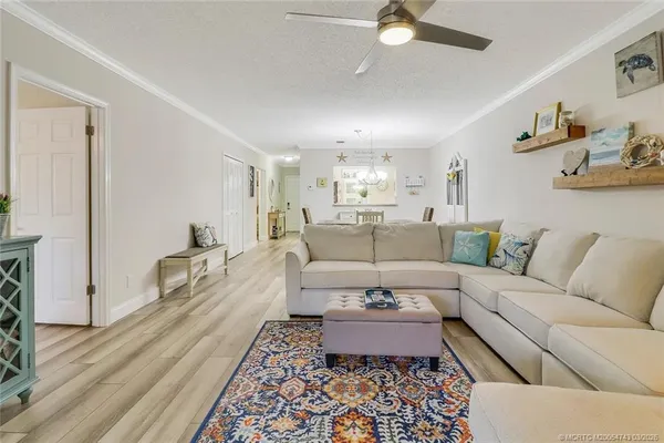 a living room with furniture or couch and a rug