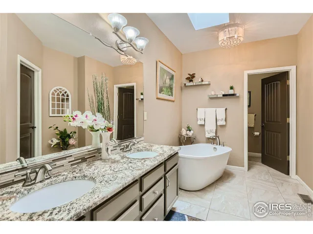 a bath room with a bathtub and potted plant