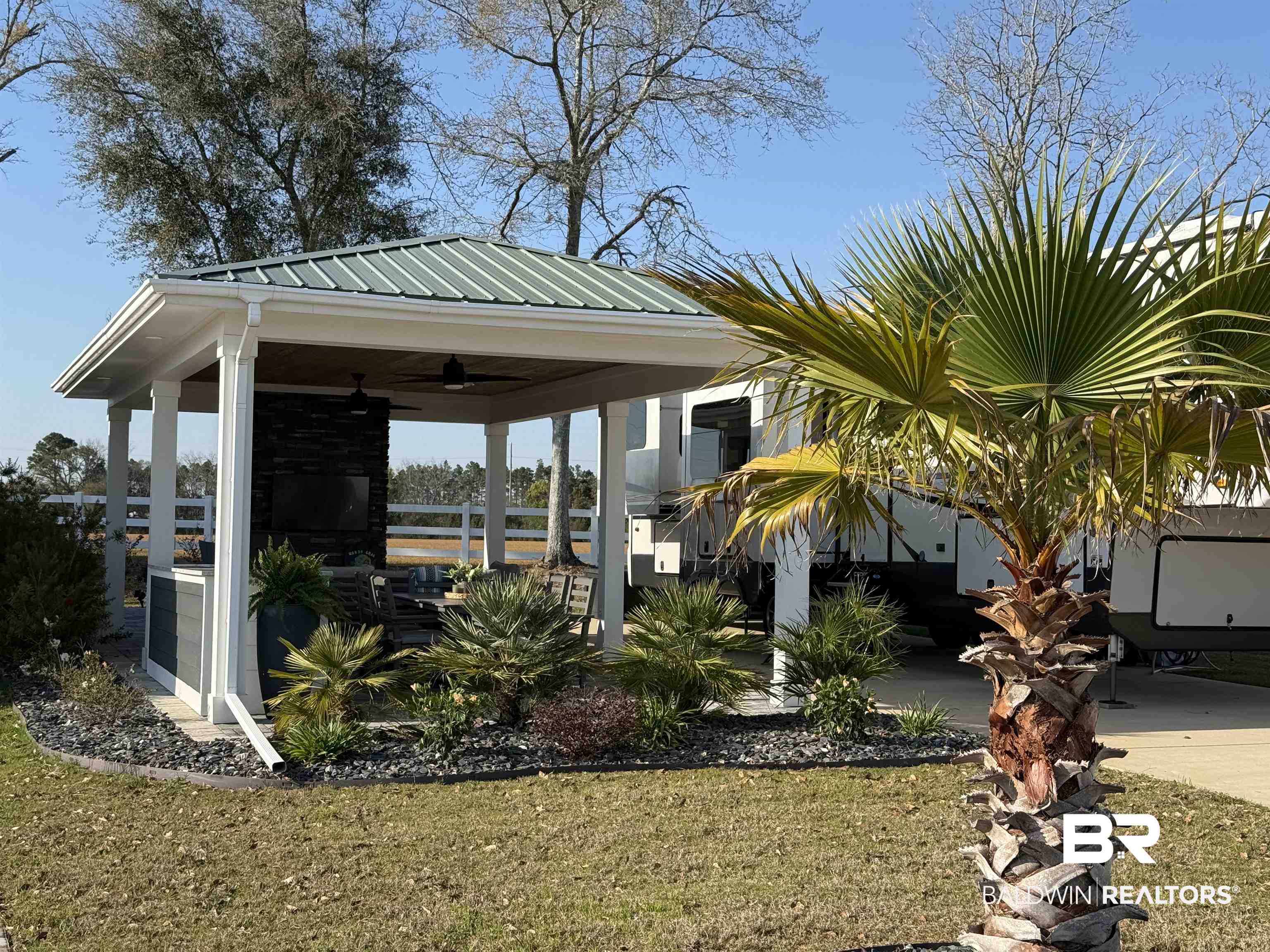12377 Gateway Drive Elberta, AL 36530 - Photo 1 of 64 View of green lawn with a ceiling fan