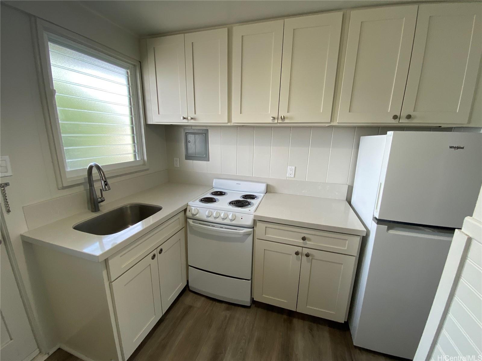 a utility room with sink dryer and washer