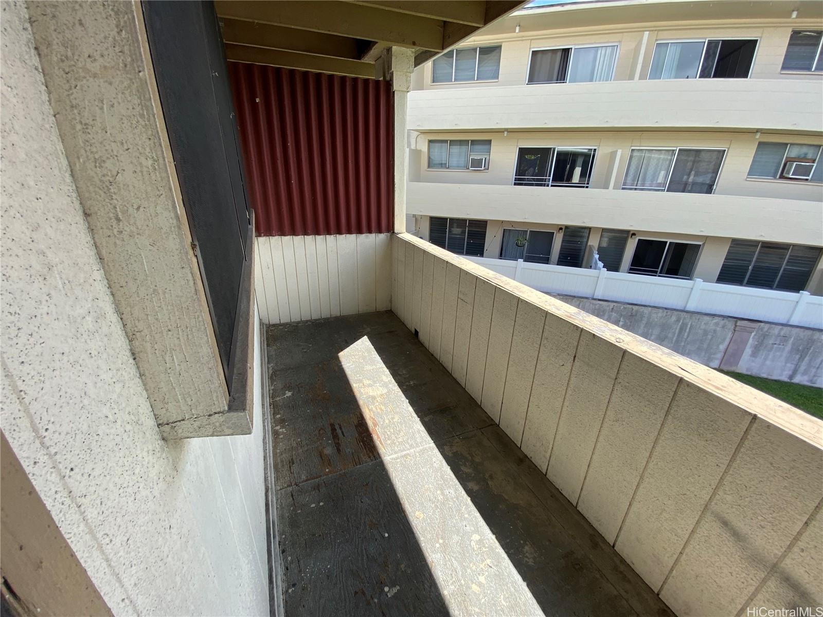 120 Kihapai Street, Unit 9 Kailua, HI 96734 - Photo 6 of 6 a view of balcony with wooden floor