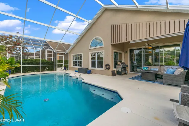 a view of a house with a swimming pool