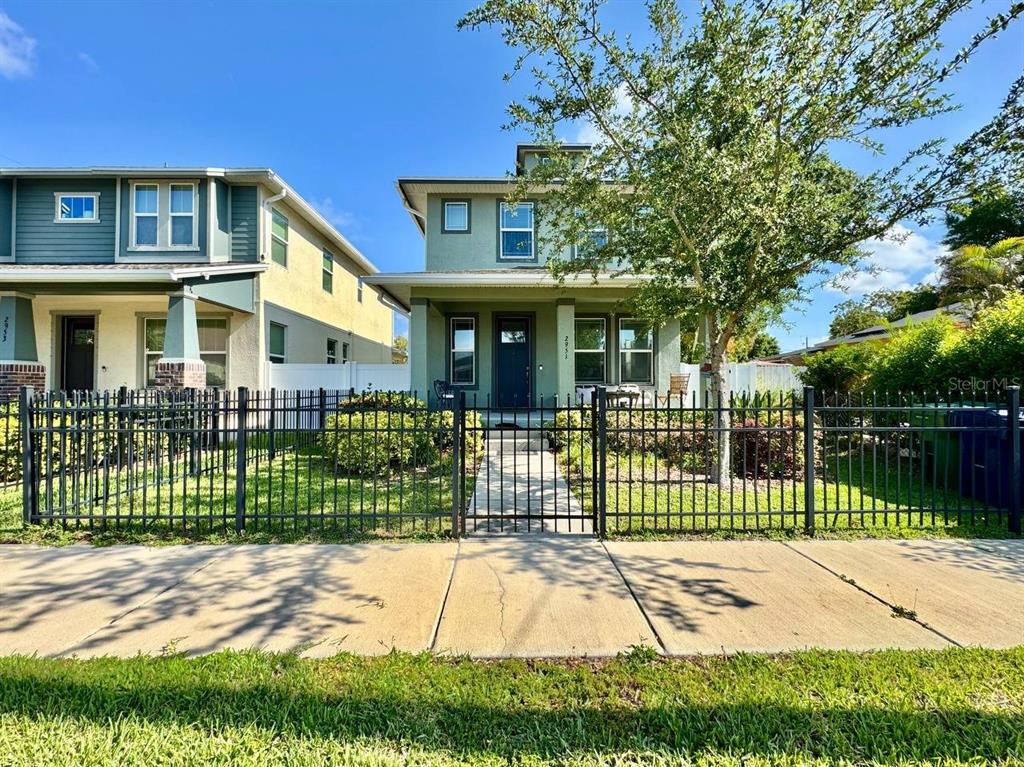 2951 West Cherry Street Tampa, FL 33607 - Photo 1 of 25 a front view of a house with a garden and plants