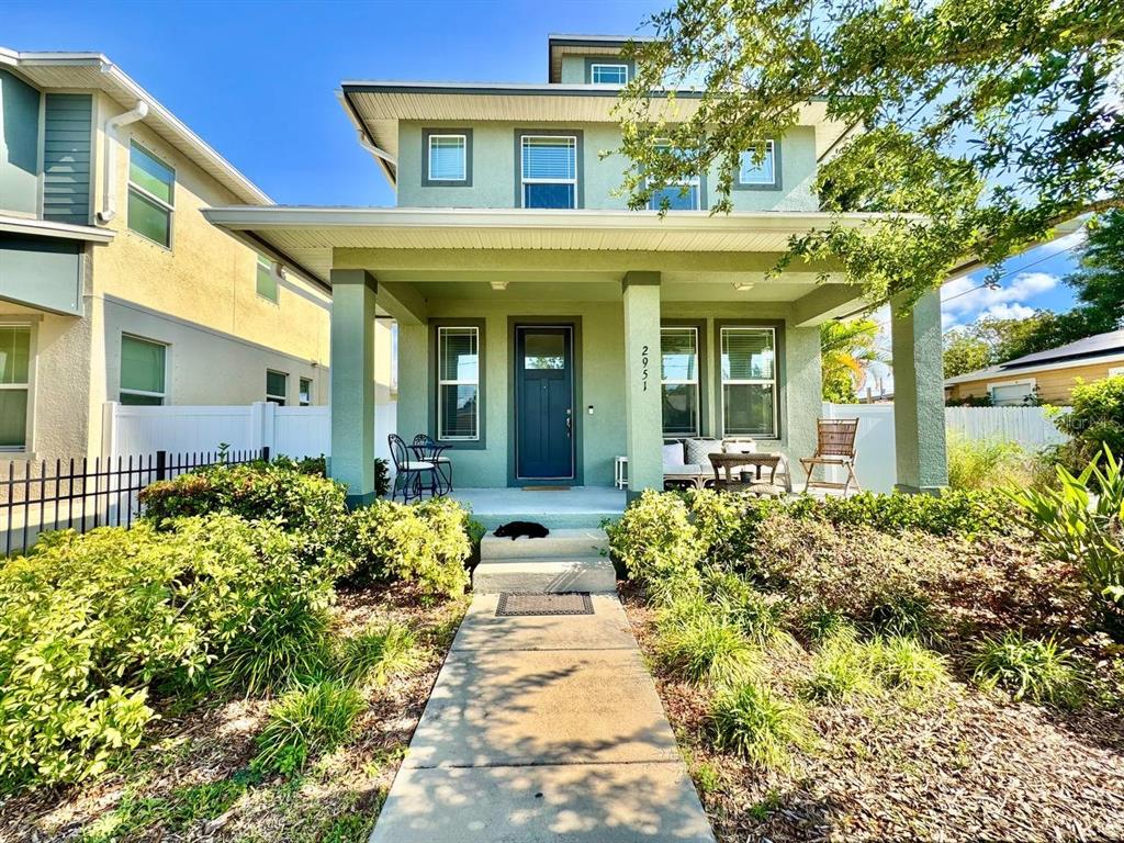 2951 West Cherry Street Tampa, FL 33607 - Photo 2 of 25 a front view of a house with a yard
