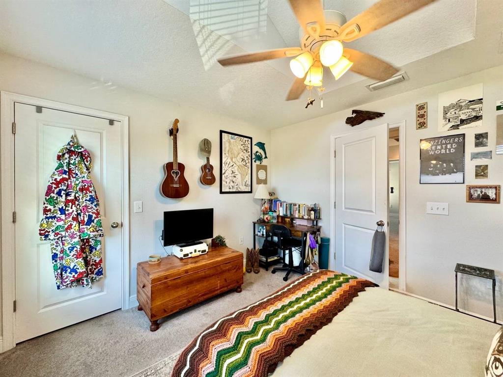 2951 West Cherry Street Tampa, FL 33607 - Photo 23 of 25 a bedroom with a bed and a chandelier