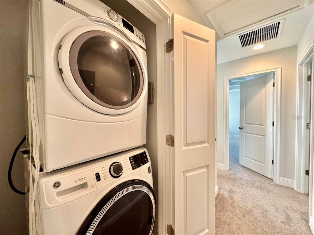 2951 West Cherry Street Tampa, FL 33607 - Photo 24 of 25 a view of a storage and utility room with dryer and washer