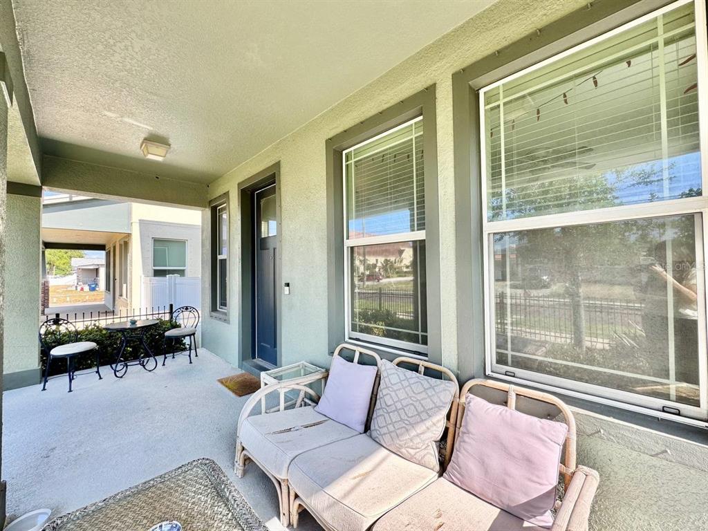 2951 West Cherry Street Tampa, FL 33607 - Photo 4 of 25 a living room with furniture and floor to ceiling windows