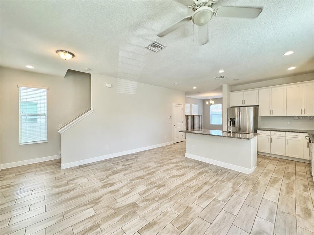 2951 West Cherry Street Tampa, FL 33607 - Photo 6 of 25 a large kitchen with stainless steel appliances kitchen island a large counter space a sink appliances and cabinets