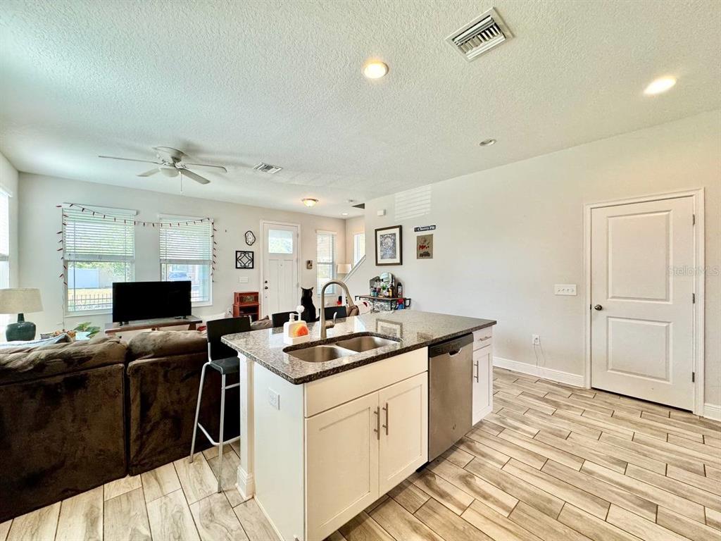 2951 West Cherry Street Tampa, FL 33607 - Photo 10 of 25 a kitchen with a stove a sink and a refrigerator