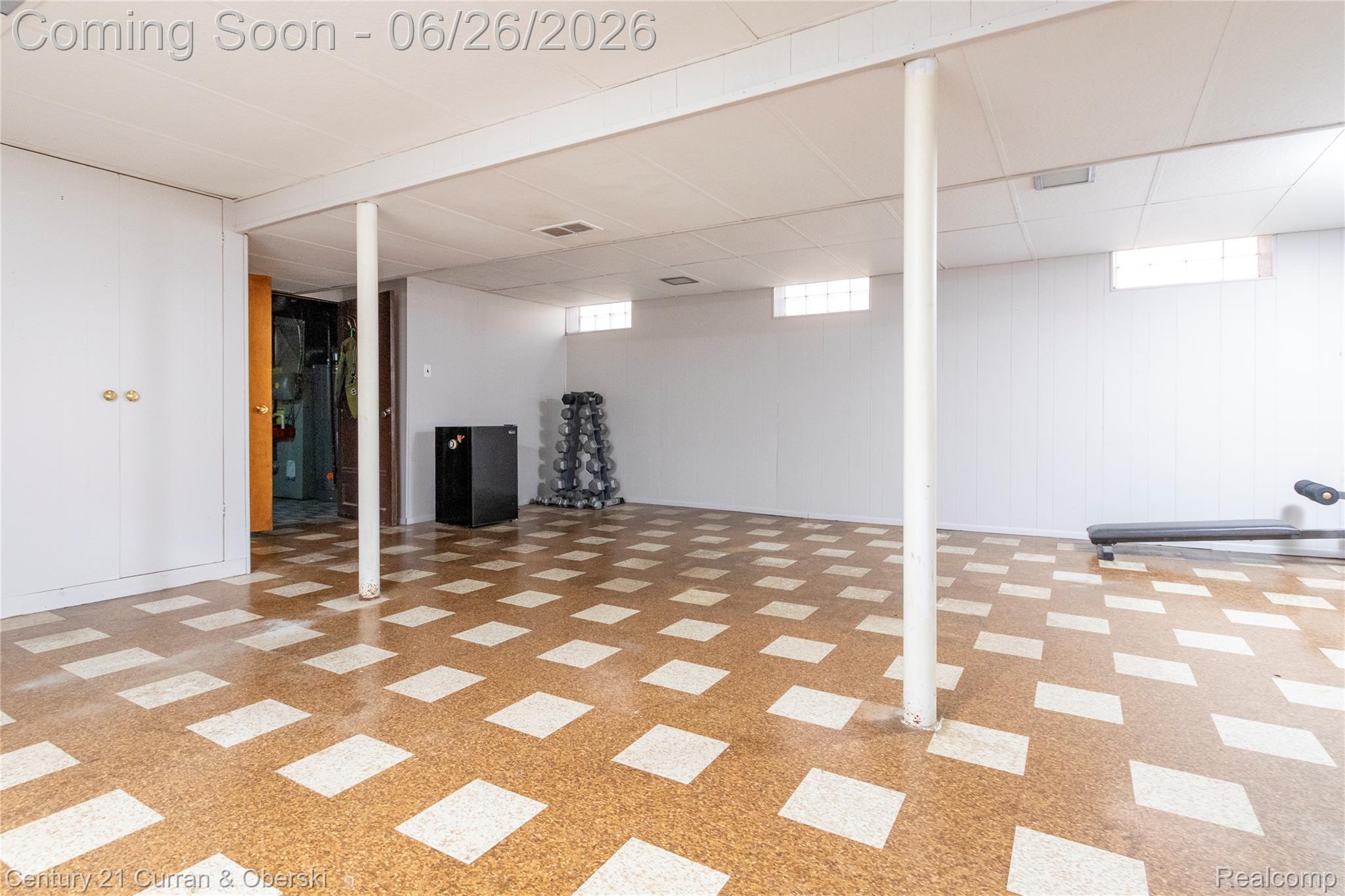 3220 Alice Street Dearborn, MI 48124 - Photo 24 of 39 Spacious lower-level room featuring patterned flooring, paneled walls, and a drop ceiling