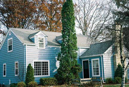 1624 Warren Road Rockford, IL 61108 - Photo 1 of 6 a front view of a house with a garden