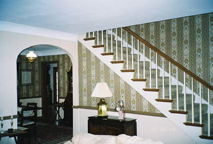 1624 Warren Road Rockford, IL 61108 - Photo 2 of 6 a view of staircase with furniture and a window