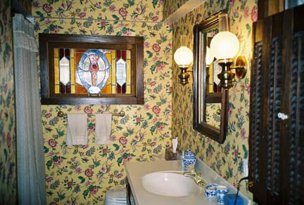 1624 Warren Road Rockford, IL 61108 - Photo 4 of 6 a bathroom with a toilet sink and mirror