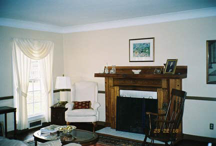1624 Warren Road Rockford, IL 61108 - Photo 5 of 6 a living room with furniture a fireplace and a window