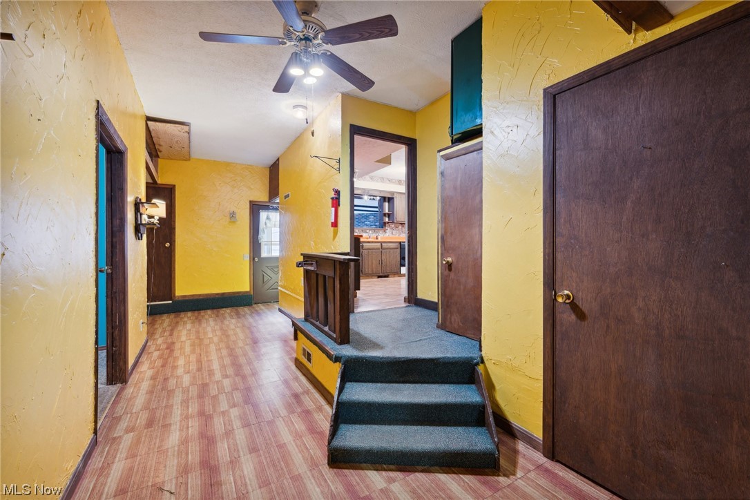 2715 Douglas Road Ashtabula, OH 44004 - Photo 20 of 34 Stairs featuring ceiling fan