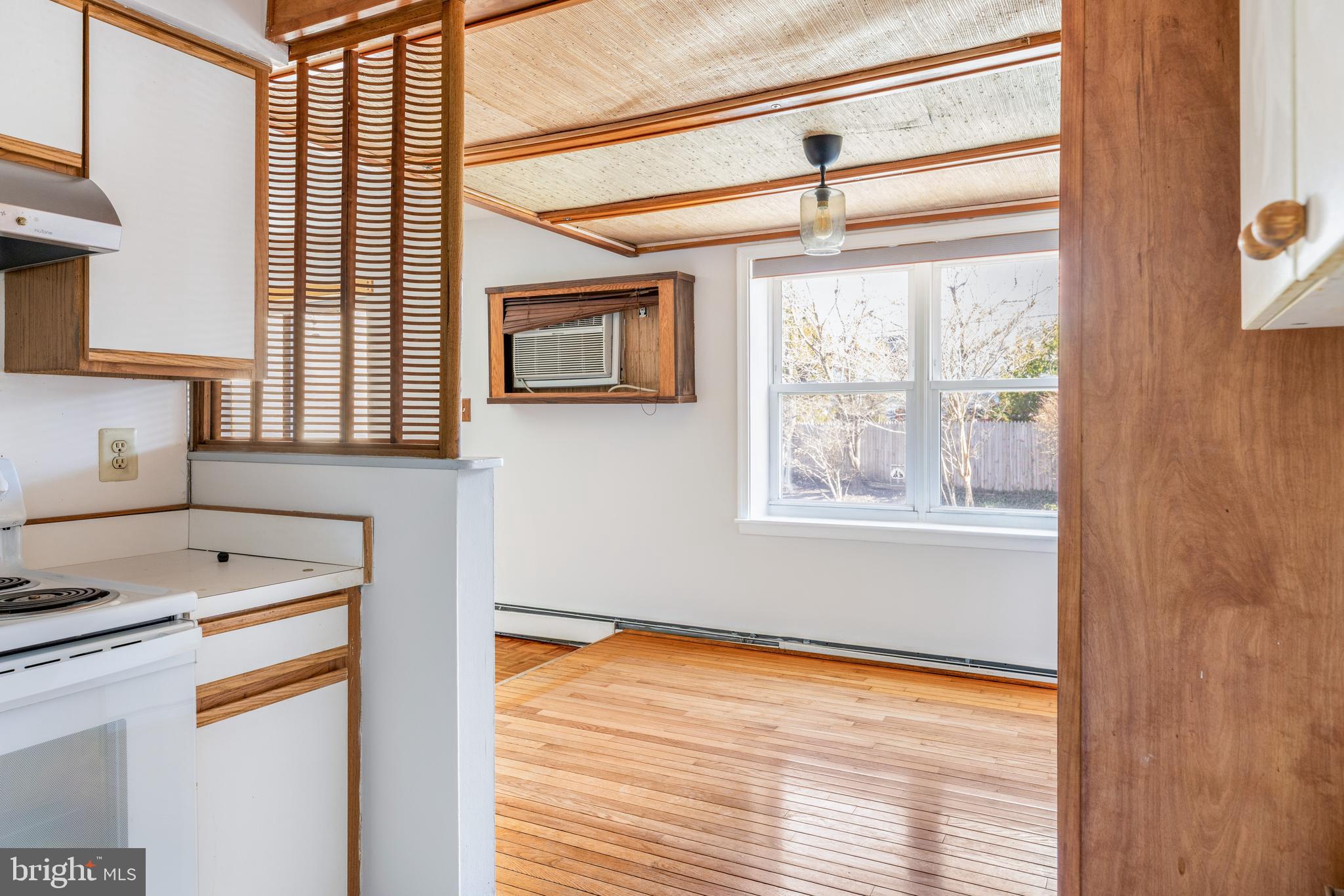 222 East Montgomery Avenue, Unit 207 Ardmore, PA 19003 - Photo 13 of 20 a kitchen view of a window wooden floor and a sink
