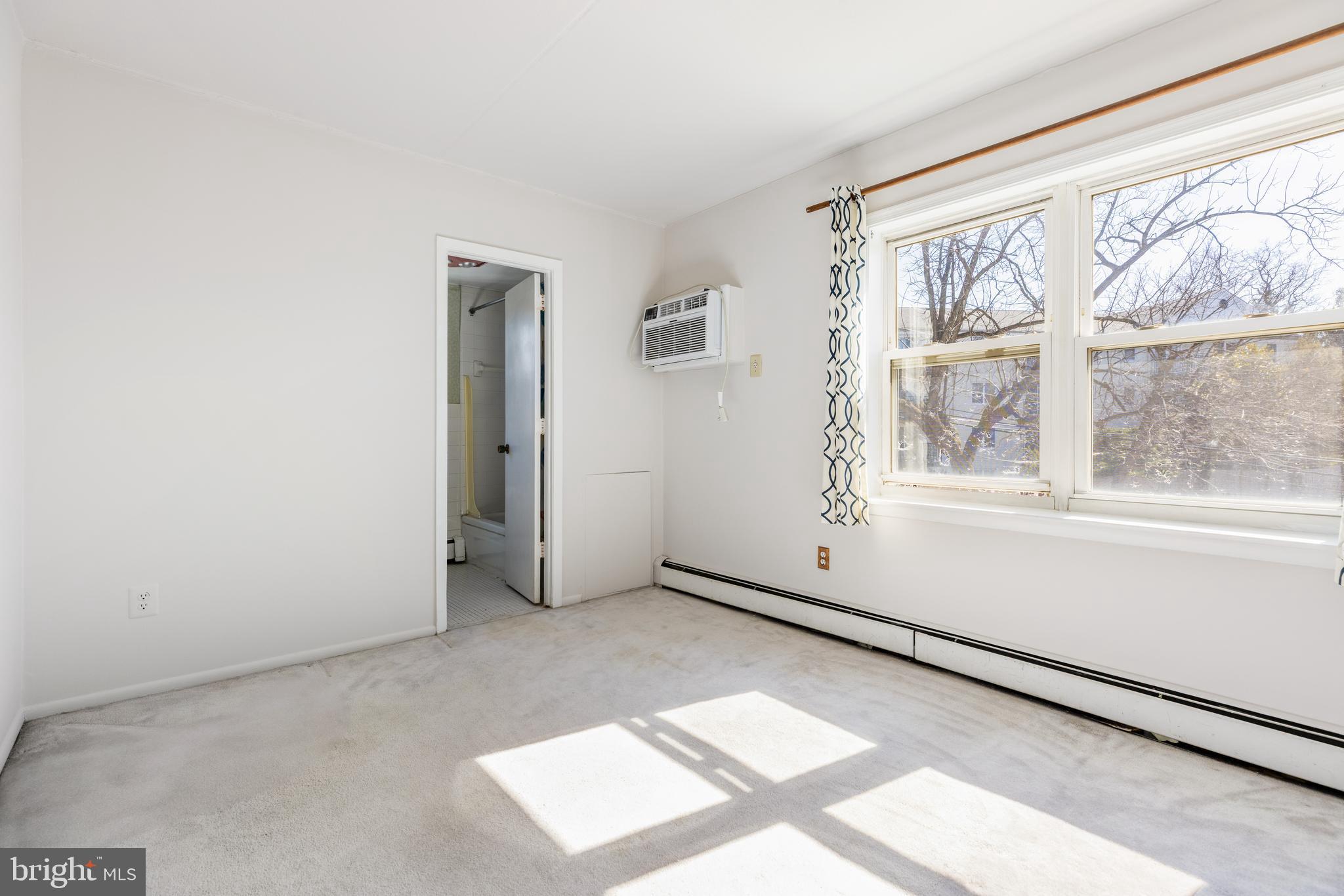 222 East Montgomery Avenue, Unit 207 Ardmore, PA 19003 - Photo 15 of 20 an empty room with windows
