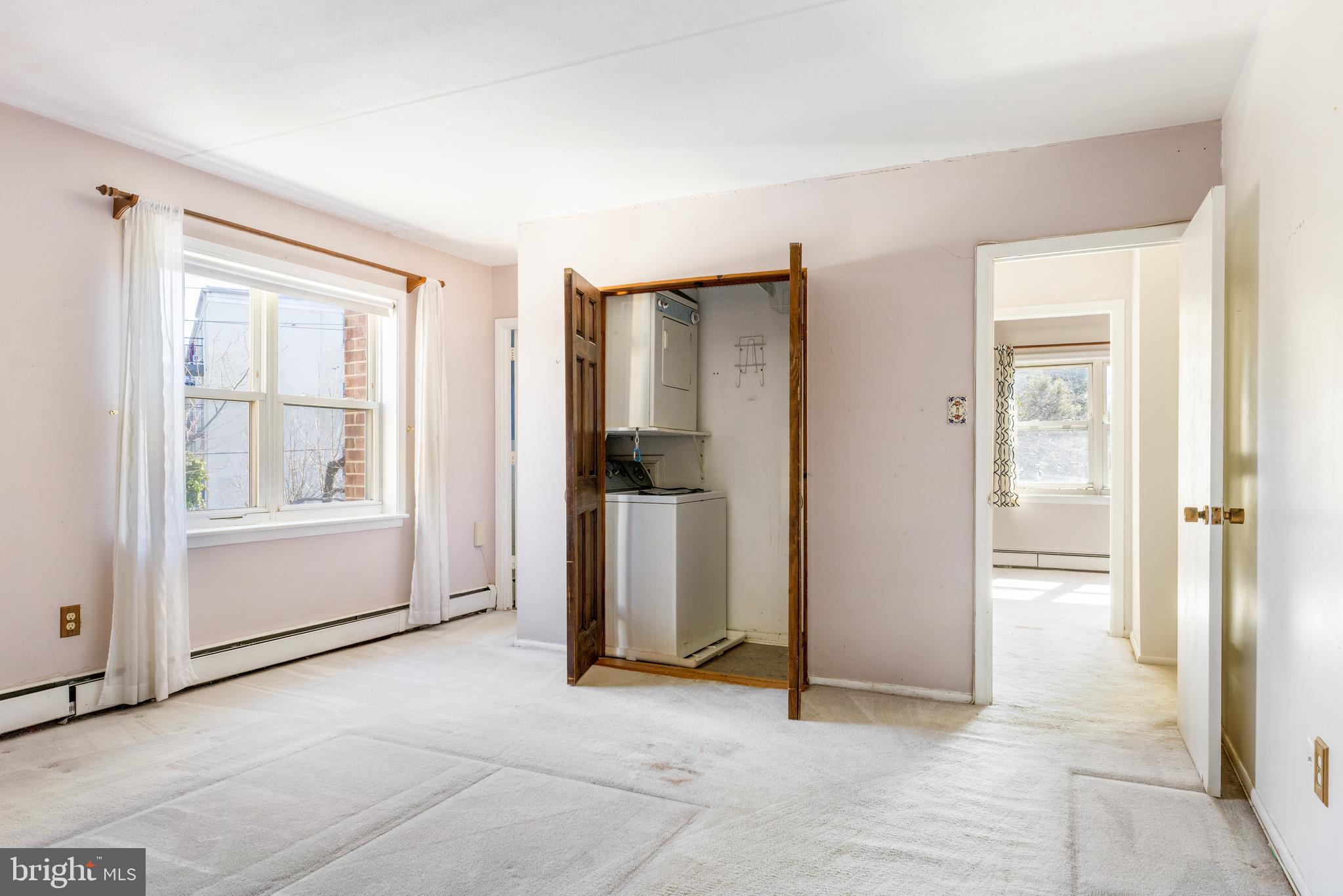 222 East Montgomery Avenue, Unit 207 Ardmore, PA 19003 - Photo 17 of 20 an empty room with windows and closet