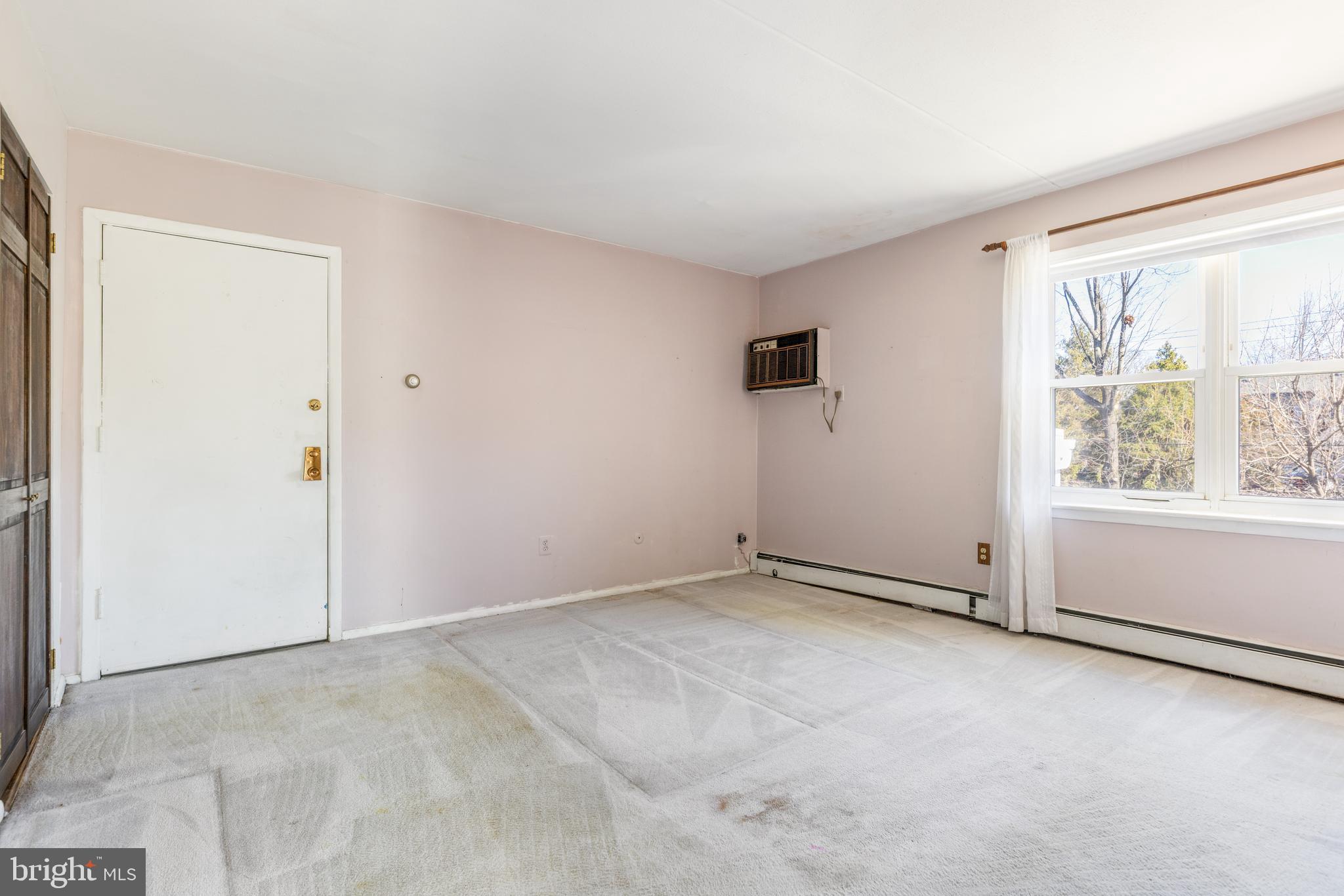 222 East Montgomery Avenue, Unit 207 Ardmore, PA 19003 - Photo 18 of 20 an empty room with windows