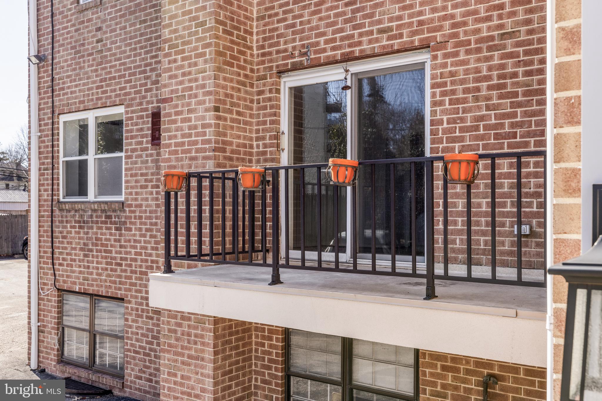 222 East Montgomery Avenue, Unit 207 Ardmore, PA 19003 - Photo 5 of 20 a view of a brick house with a window