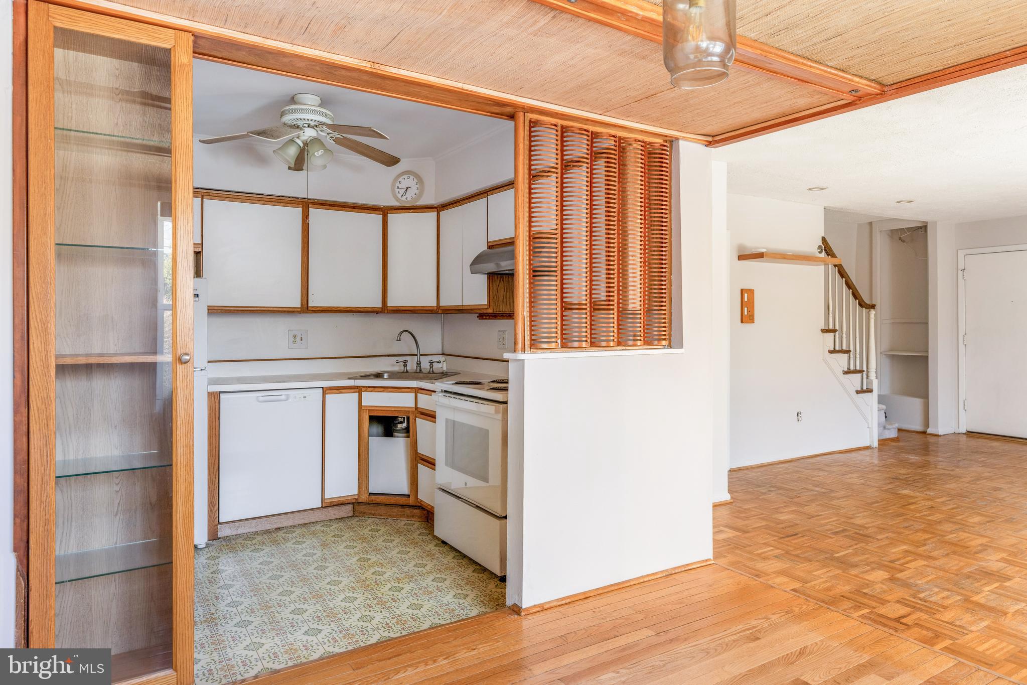 222 East Montgomery Avenue, Unit 207 Ardmore, PA 19003 - Photo 8 of 20 a kitchen with stainless steel appliances granite countertop a stove a sink and a refrigerator