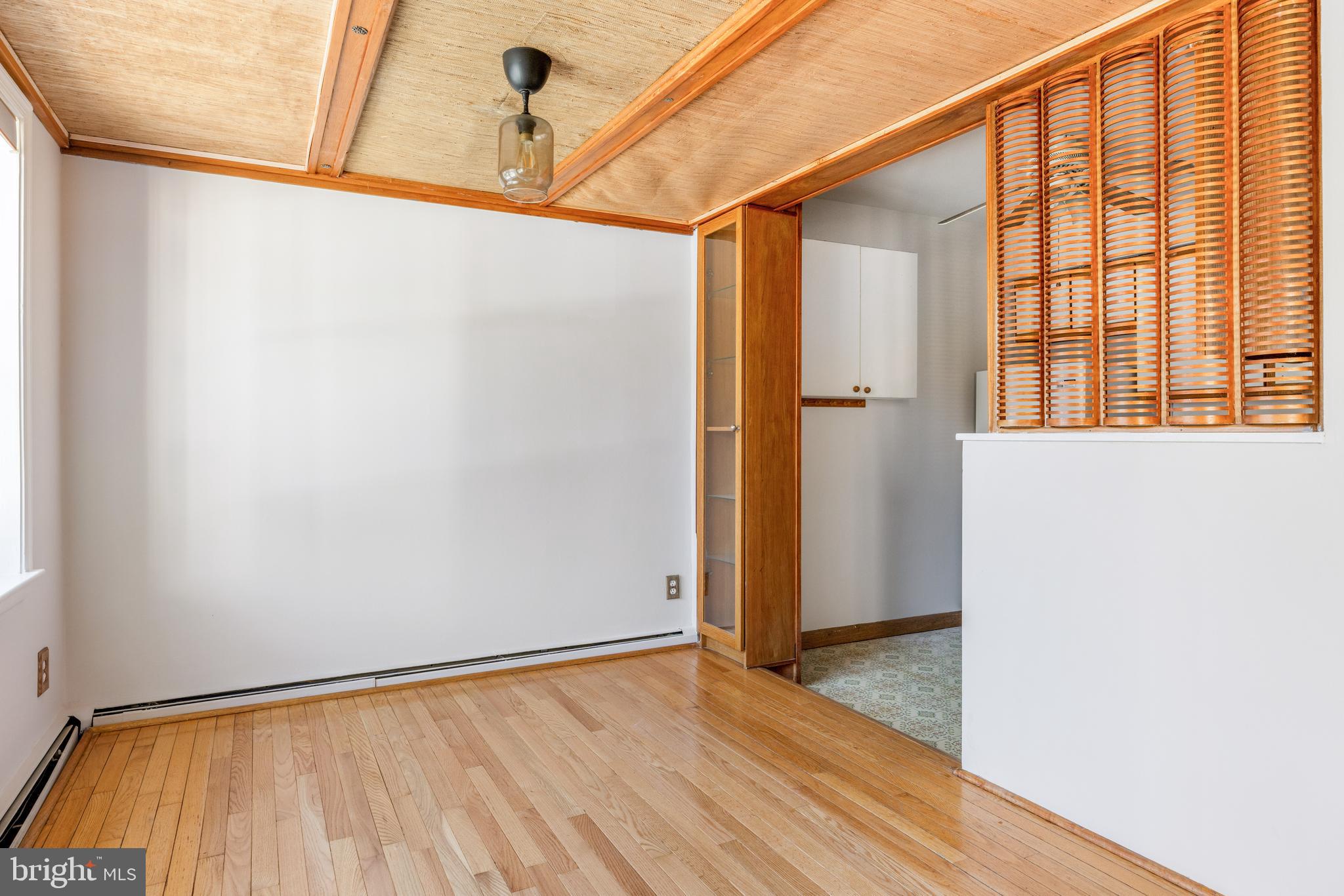 222 East Montgomery Avenue, Unit 207 Ardmore, PA 19003 - Photo 9 of 20 a view of a room with wooden floor and windows