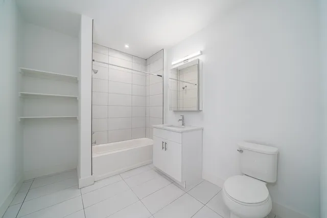 a bathroom with a toilet a sink and bathtub