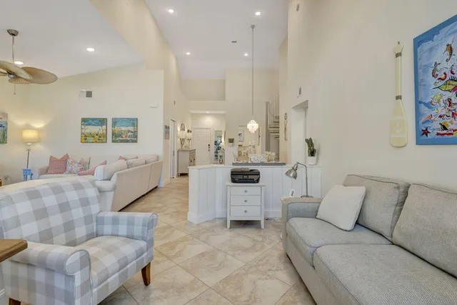 a kitchen with granite countertop white cabinets and sink