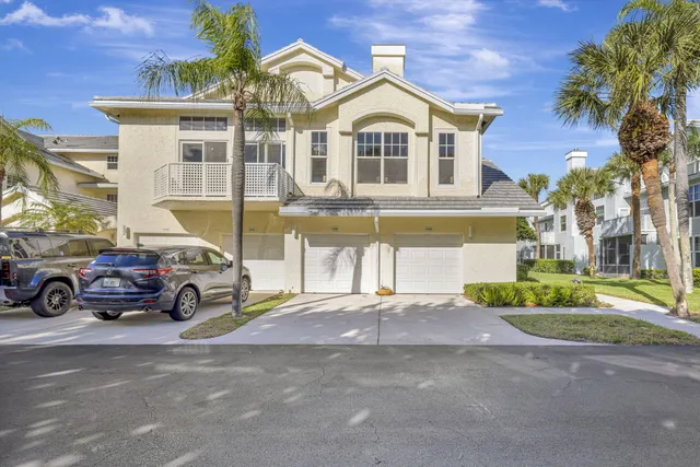 a view of a parked cars in front of a house